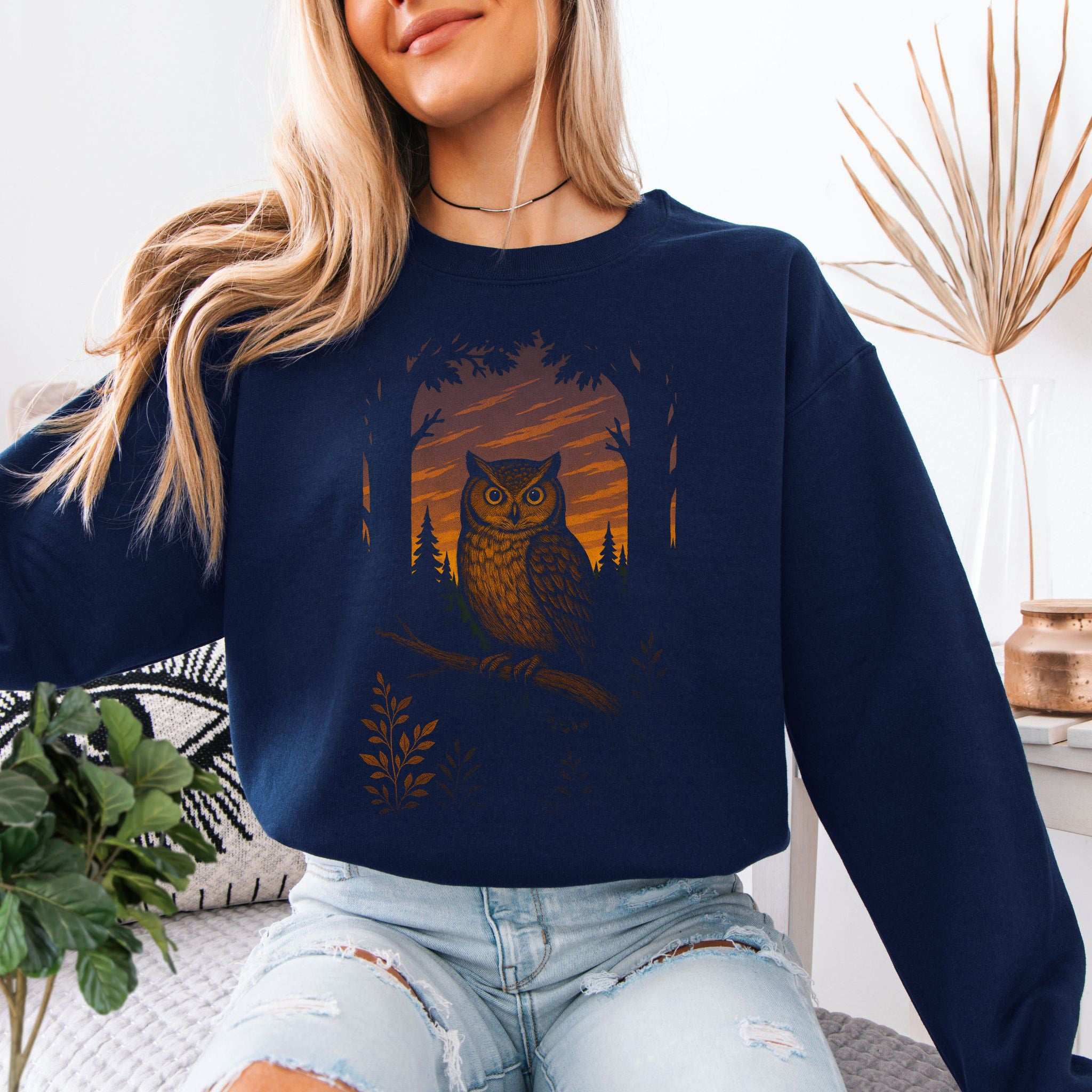 Owl Spirit Animal Sweatshirt – Sunset Forest Gaze Vibes worn by a model featuring owl design in sunset forest.