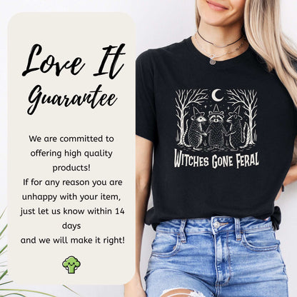 Witches Gone Feral Halloween T-shirt featuring a raccoon, opossum, and skunk under a crescent moon.