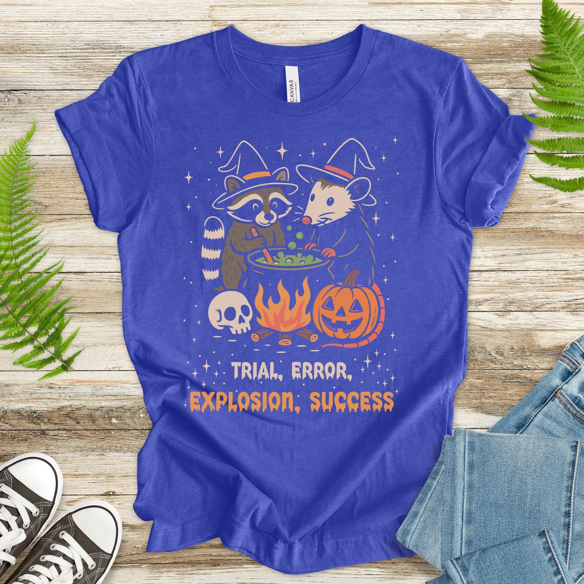 Potion Explosion Halloween T-shirt with raccoon and opossum, featuring trial, error, explosion, success design.
