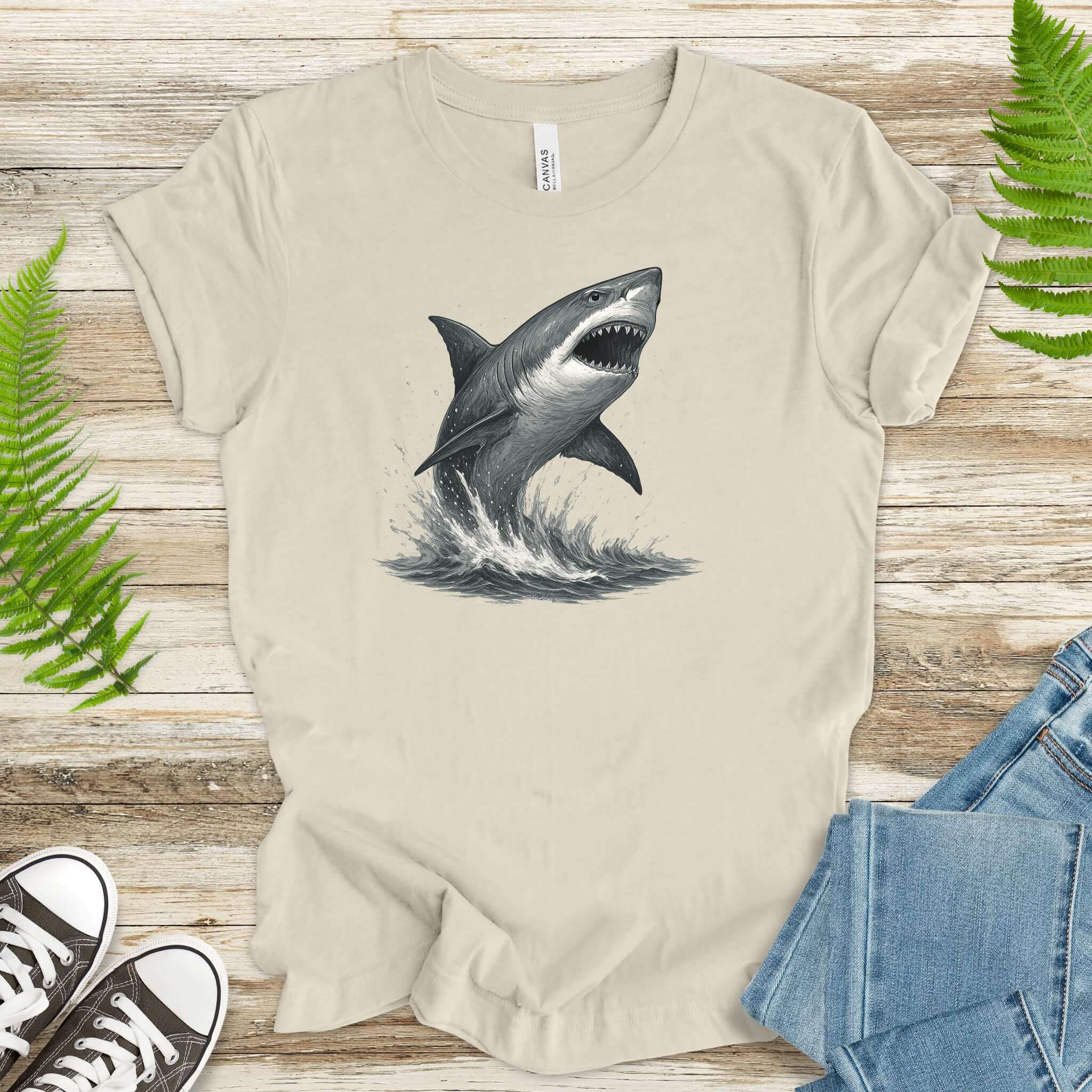 Great White Shark T-Shirt showcasing a lifelike shark breaching waves, perfect for ocean lovers and shark enthusiasts.