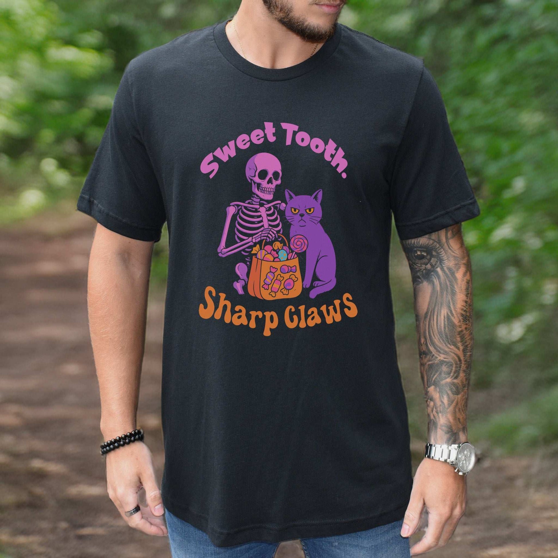 Skeleton and Grumpy Cat Halloween T-shirt featuring 'Sweet Tooth, Sharp Claws' design, perfect for spooky season.