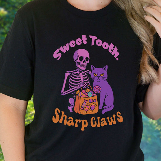 Skeleton and Grumpy Cat Halloween T-shirt featuring candy, sharp claws, and sweet tooth design.