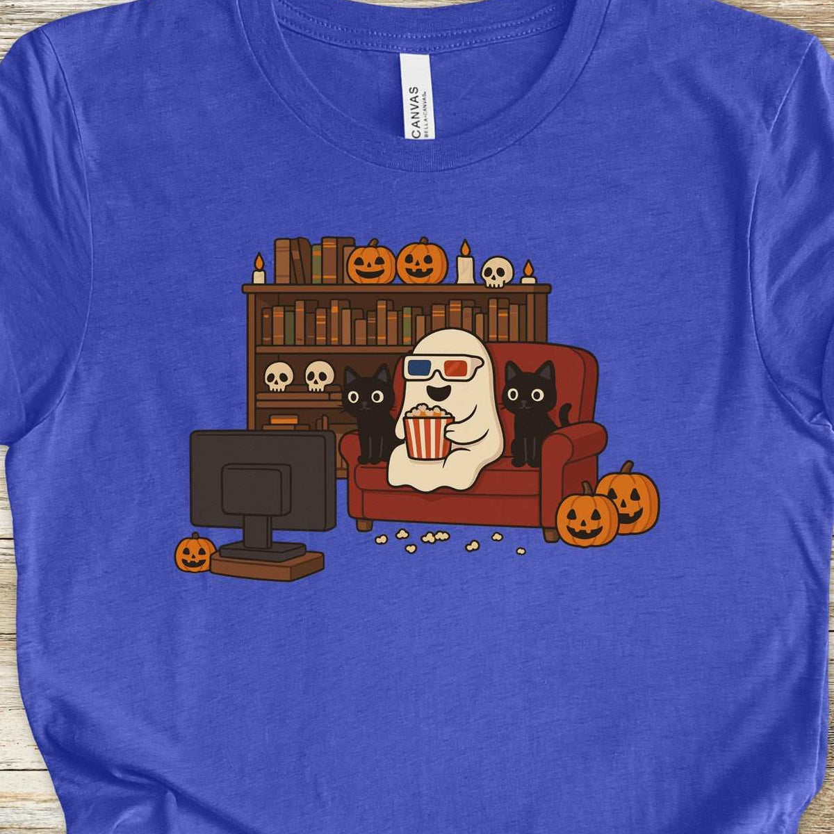 A ghost in 3D glasses with two black cats watching a movie, retro illustration on a Heather True Royal T-shirt