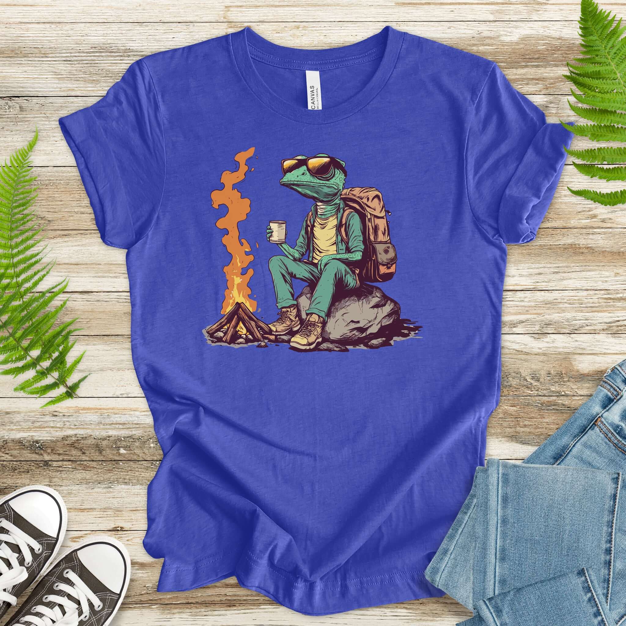 Chameleon sitting near a campfire t-shirt in blue, featuring a relaxed chameleon enjoying a cozy brew.