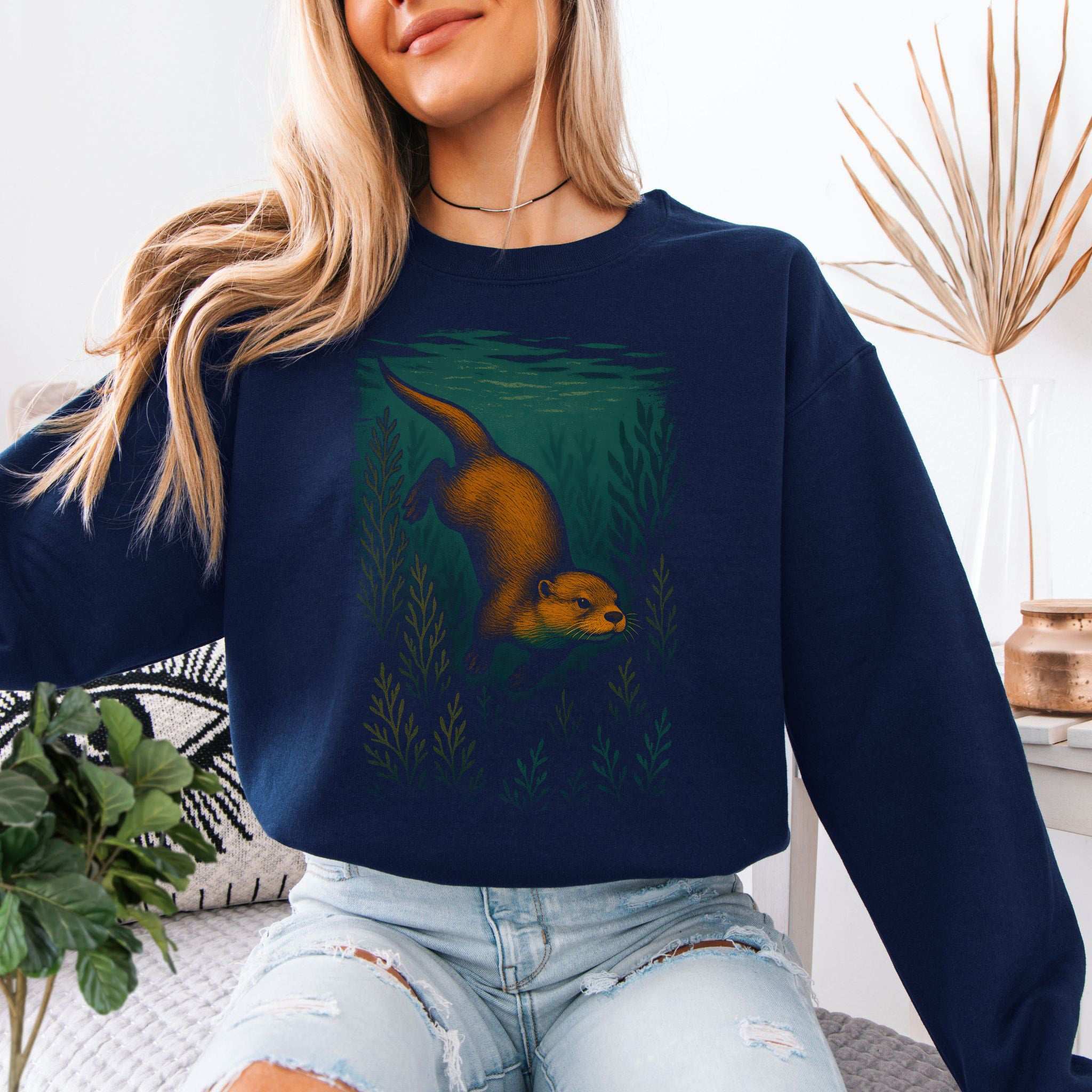 Otter Spirit Animal Sweatshirt – Playful River Magic Vibes featuring an otter swimming in underwater greenery.