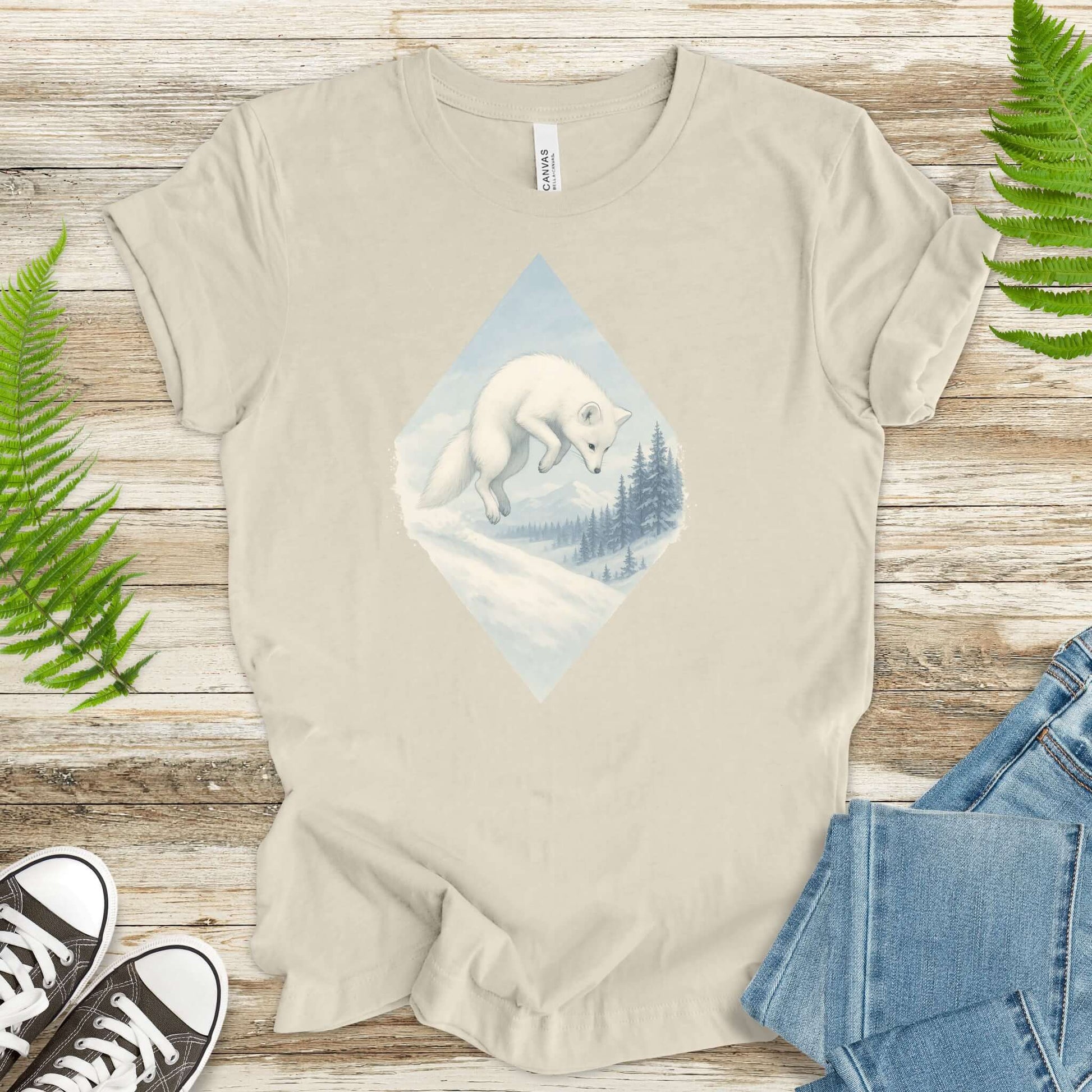 Jumping white fox in snow design on a light shirt, perfect for fantasy lovers and animal enthusiasts.