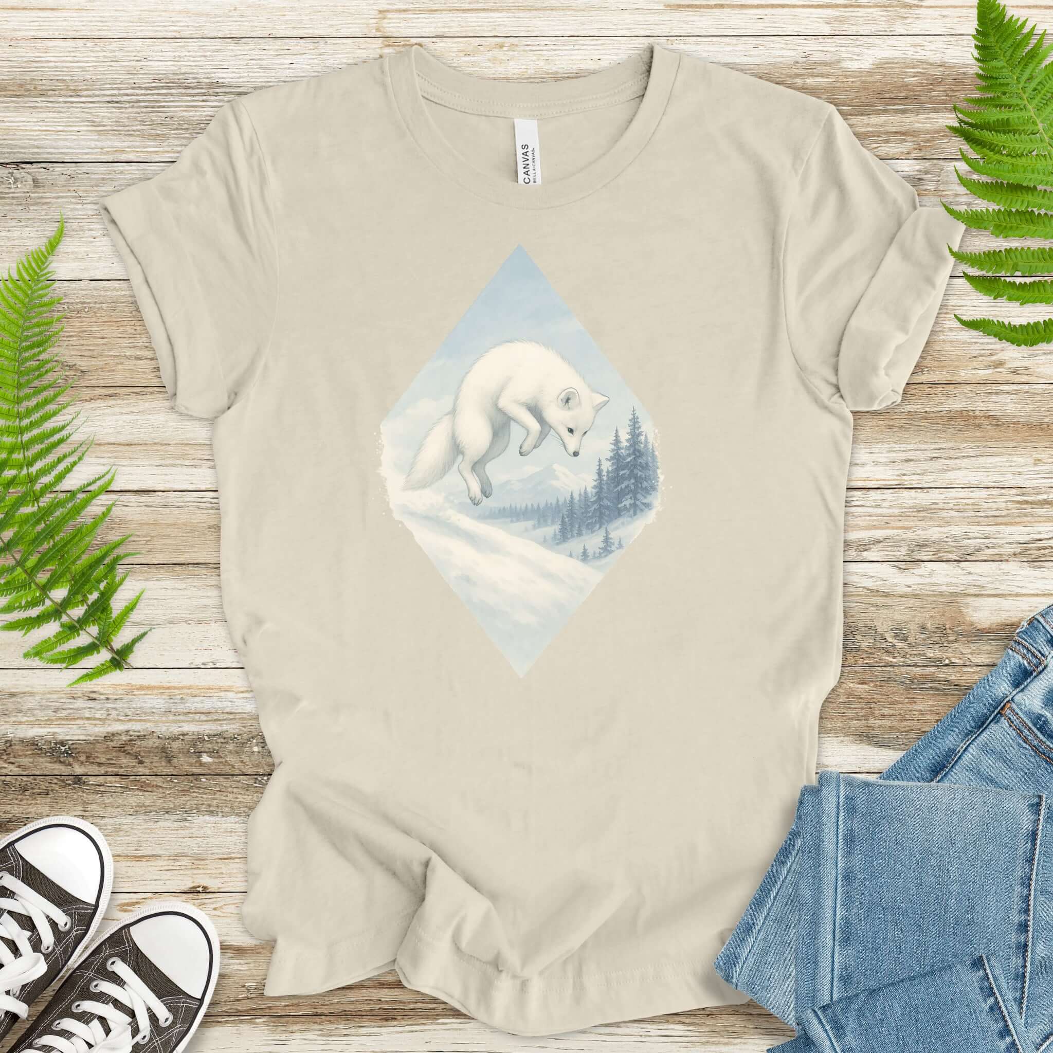 Jumping white fox in snow design on a light shirt, perfect for fantasy lovers and animal enthusiasts.