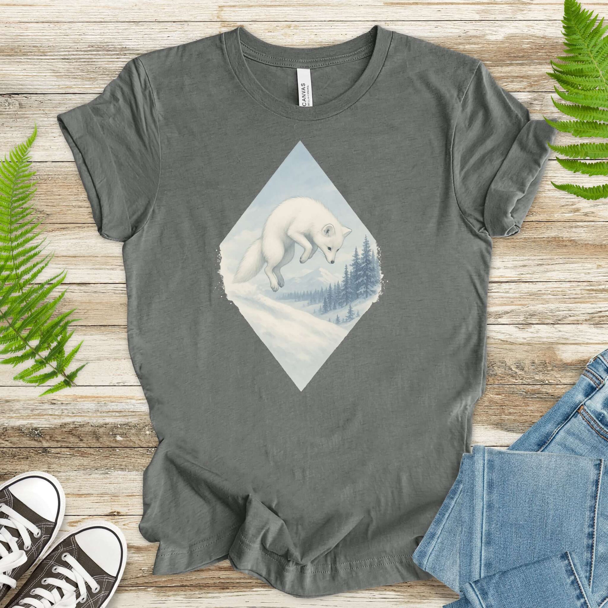 Jumping white fox in snow design on gray t-shirt for fantasy lovers and animal enthusiasts.