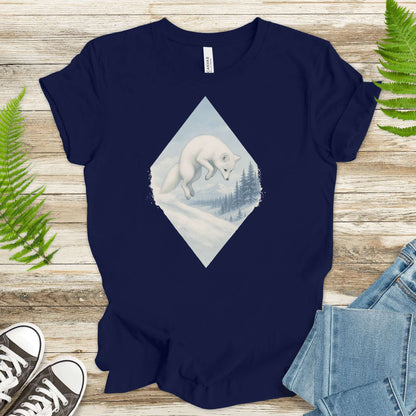 White fox leaping in snow on navy t-shirt; perfect for fantasy lovers and animal enthusiasts.