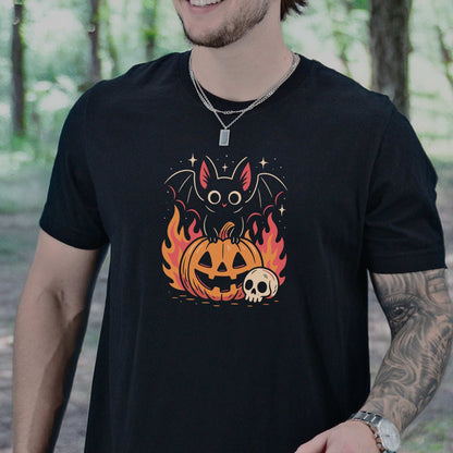 Spooky Bat Halloween T-Shirt featuring a cute bat on a fiery jack-o'-lantern, perfect for goths and pumpkin lovers.